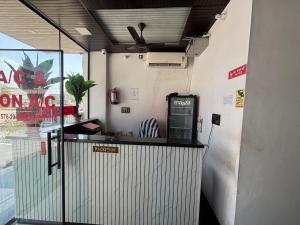 a ticket counter with a pay phone at a restaurant at Hotel Narayan free Parking & Near Toran Dwar in Khātu
