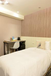 Postel nebo postele na pokoji v ubytování Ark Hotel - Changan Fuxing方舟商業股份有限公司