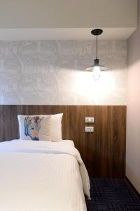 Postel nebo postele na pokoji v ubytování Ark Hotel - Changan Fuxing方舟商業股份有限公司