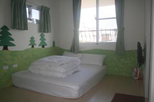 Un pat sau paturi într-o cameră la Bella Casa B&B
