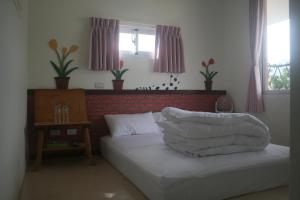 Un pat sau paturi într-o cameră la Bella Casa B&B