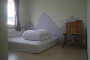 Un pat sau paturi într-o cameră la Bella Casa B&B