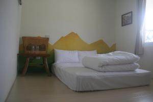 Un pat sau paturi într-o cameră la Bella Casa B&B