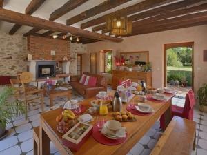 a living room with a table with food on it at Le Clos du Piheux in Thorigné-dʼAnjou +3 photos