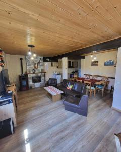 a living room with a couch and a table at Villa O Sole Mio in Progled