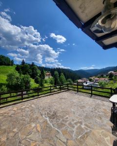 a large patio with a view of the mountains at Villa O Sole Mio in Progled