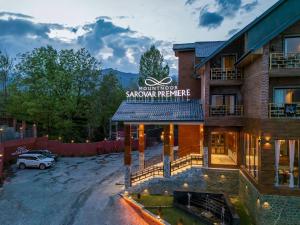 a building with a sign that reads wolfenstein snowagency at Mountnoor Sarovar Premiere Pahalgam in Anantnāg