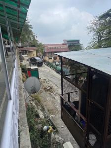 a bird cage on the side of a building at Sewa Kunj in Mussoorie