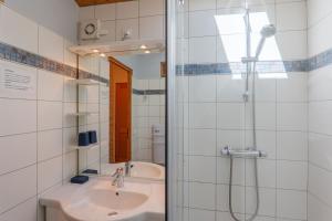 a bathroom with a sink and a shower at Gite Du Mouredon in Vallon-Pont-dʼArc +15 photos