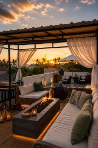 a patio with two couches and a fire place at 20 off Special Brilliant Location in Seminyak