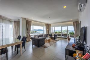 a living room with a couch and a table at Queenco Entertainment Resort in Sihanoukville