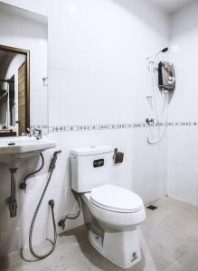 a bathroom with a toilet and a sink at Ra Residence Phuket in Chalong 