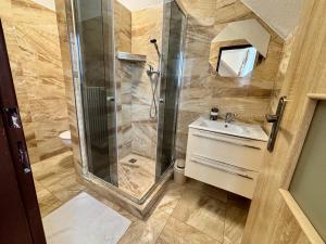 a bathroom with a shower and a sink at Villa Holiday Tatry in Nová Lesná +83 photos