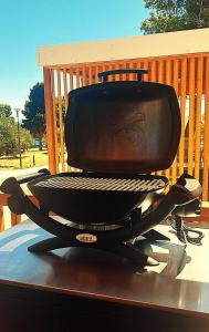 a grill sitting on top of a deck at SEA HOUSE mobile home, pool, bikes, SUP - PRIVILEGE POINT camping & villas in Orebić