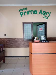 a hotel prime exit sign in a waiting room at Hotel Prima Asri 153 in Batu