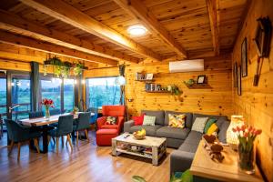 a living room with a couch and a table at Lika View house in Gospić