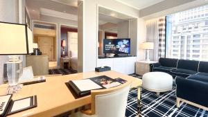 an office with a desk and a living room at THE LIN Hotel in Taichung