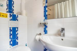 a bathroom with a sink and a toilet at Über den Dächern in Cochem Altstadt in Cochem +17 photos