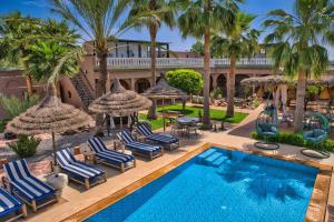 an image of a swimming pool at a resort at Kasbah Beldy Chic Marrakech, heated pool, spa in Marrakesh