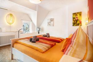 a bedroom with a large bed with blankets on it at Über den Dächern in Cochem Altstadt in Cochem