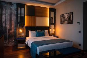 a bedroom with a large bed and a window at Expoist Hotel in Beylikduzu