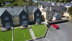 an aerial view of a house with a red car parked in front at Number 1 Bank House in Schull