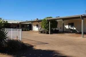 an empty parking lot in front of a building at Cobar Central Motor Inn in Cobar