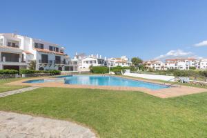an image of a swimming pool in a apartment at Villa Sol del Este, Es Castell in Es Castell