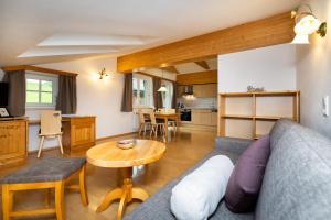 a living room with a couch and a table at Appartment Ransburggut in Flachau