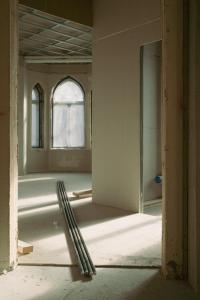 an empty room with a window and a ladder at Villa Nord in Trondheim