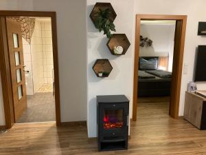 a living room with a fireplace in a room at Appartment Elfi in Uttendorf