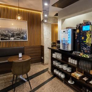 a restaurant with a table and a chair in a room at Hotel Nuevo Triunfo in Barcelona