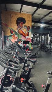 a bunch of bikes lined up in a gym at GL Luxe Suites in Tatu City