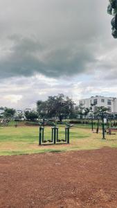 a park with a playground with swings at GL Luxe Suites in Tatu City