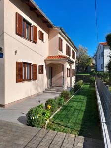 a house with a garden in front of it at Villa Marija in Opatija +11 photos