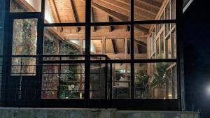 a room with a large glass window in a building at Casa rural Mirador, Balneario Histórico de Cortegada in Cortegada +4 photos
