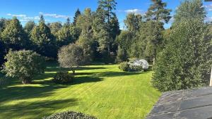 an aerial view of a yard with trees and grass at SwedenWoods in Hagfors