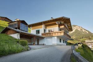 a house on the side of a road at Grundwert Apartment in Sonntag