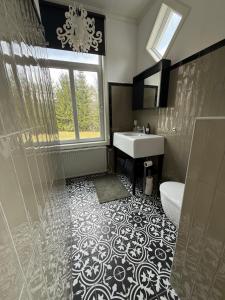 a bathroom with a sink and a shower at SwedenWoods in Hagfors