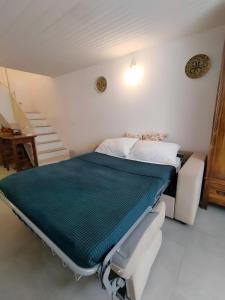 a hospital bed in a room with a staircase at Santanna106 in Santa Domenica
