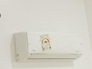 a white refrigerator with a sticker on it at Anas Nubian Guest House in Aswan