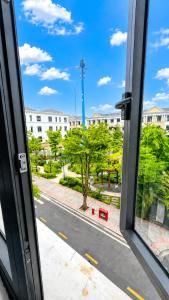 a view of a street from a window at La Mejor Homestay in Quang Tri
