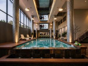 a pool in the lobby of a hotel at Beach, Restaurants, Shopping, Park, Pier - nearby in Durban
