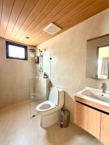 a bathroom with a toilet and a sink at Wave & Vibes Koh chang in Ban Chek Bae (1)