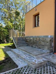 a set of stairs leading up to a house at Appartamento sole e luna in Dumenza