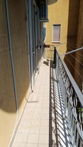 a walkway with a railing next to a building at Casa Carmela in Sapri