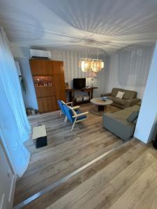 a living room with a couch and a table at Châtelaines 59 in Avallon +44 photos