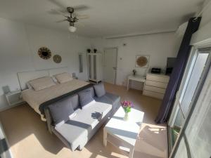 a living room with a bed and a couch at Jingtu Wellness & Spa Resort in Comares +58 photos