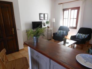 a living room with a table and chairs at Volcano View in El Golfo