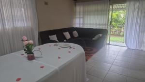 a living room with a table and a couch at Graceful Seniors in Durban